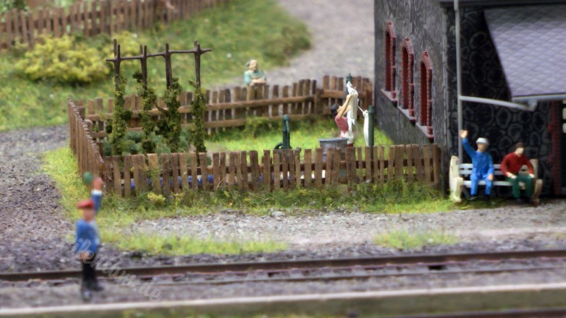 Model railway with station and very realistic landscape in HO scale