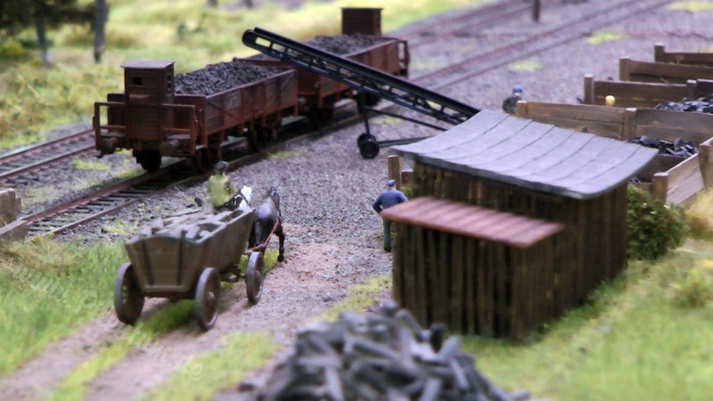 Model railway with station and very realistic landscape in HO scale