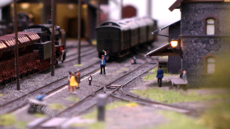 Model railway with station and very realistic landscape in HO scale