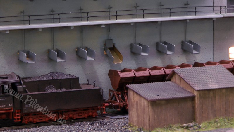 Model railway with station and very realistic landscape in HO scale