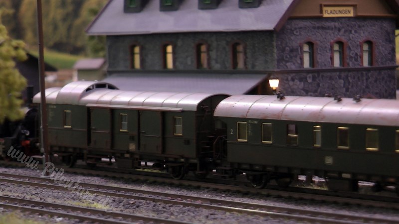 Model railway with station and very realistic landscape in HO scale