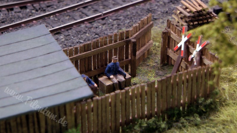 Model railway with station and very realistic landscape in HO scale