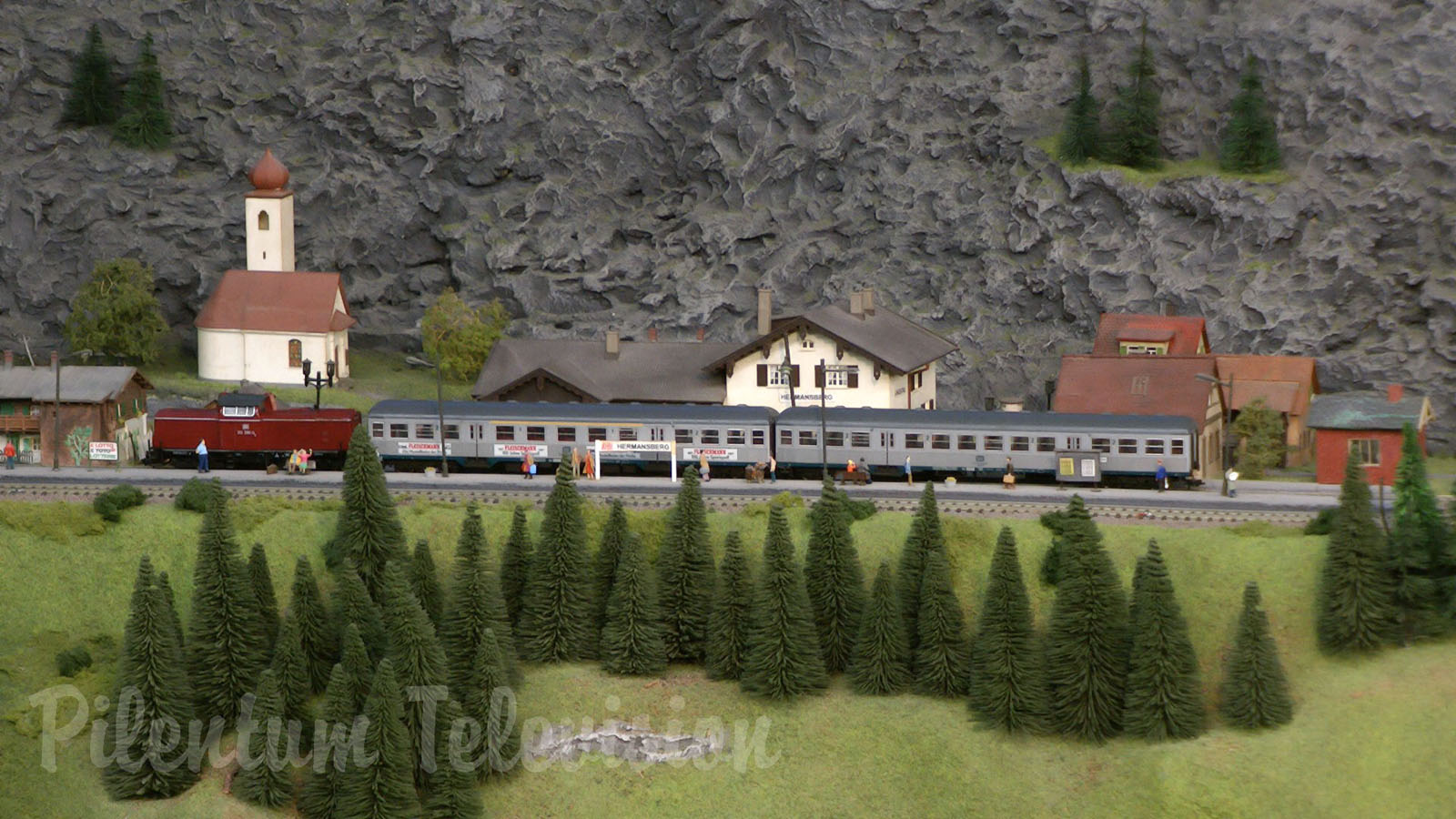 Model Railroad Layout by Modelspoor Group Nienoord with Miniature Cars and more than 100 Trains in HO Scale