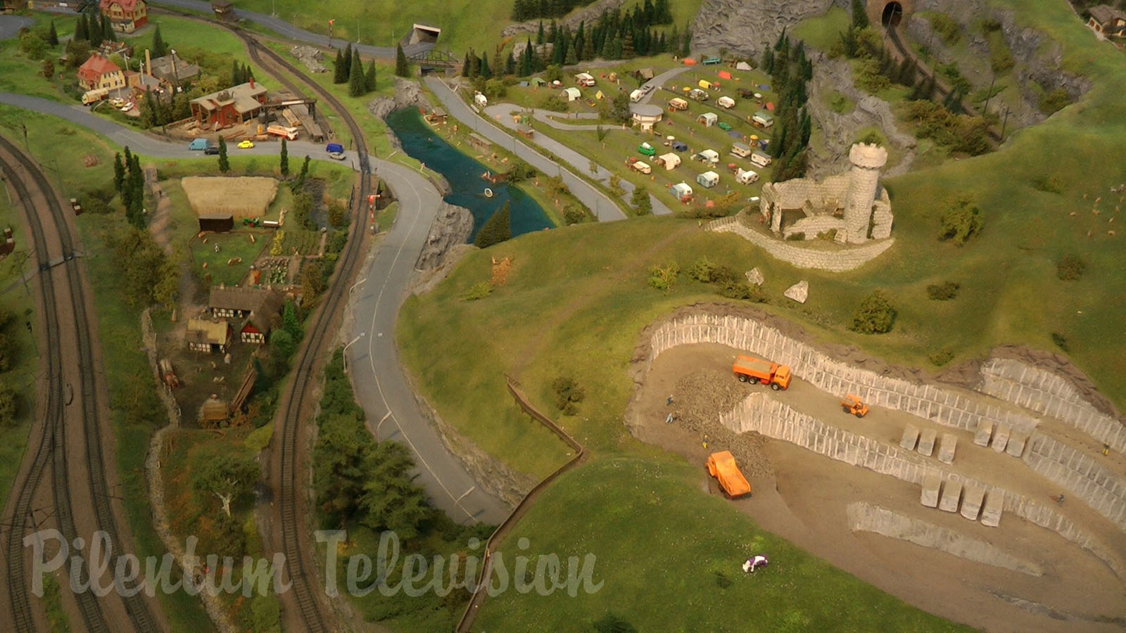 Model Railroad Layout by Modelspoor Group Nienoord with Miniature Cars and more than 100 Trains in HO Scale