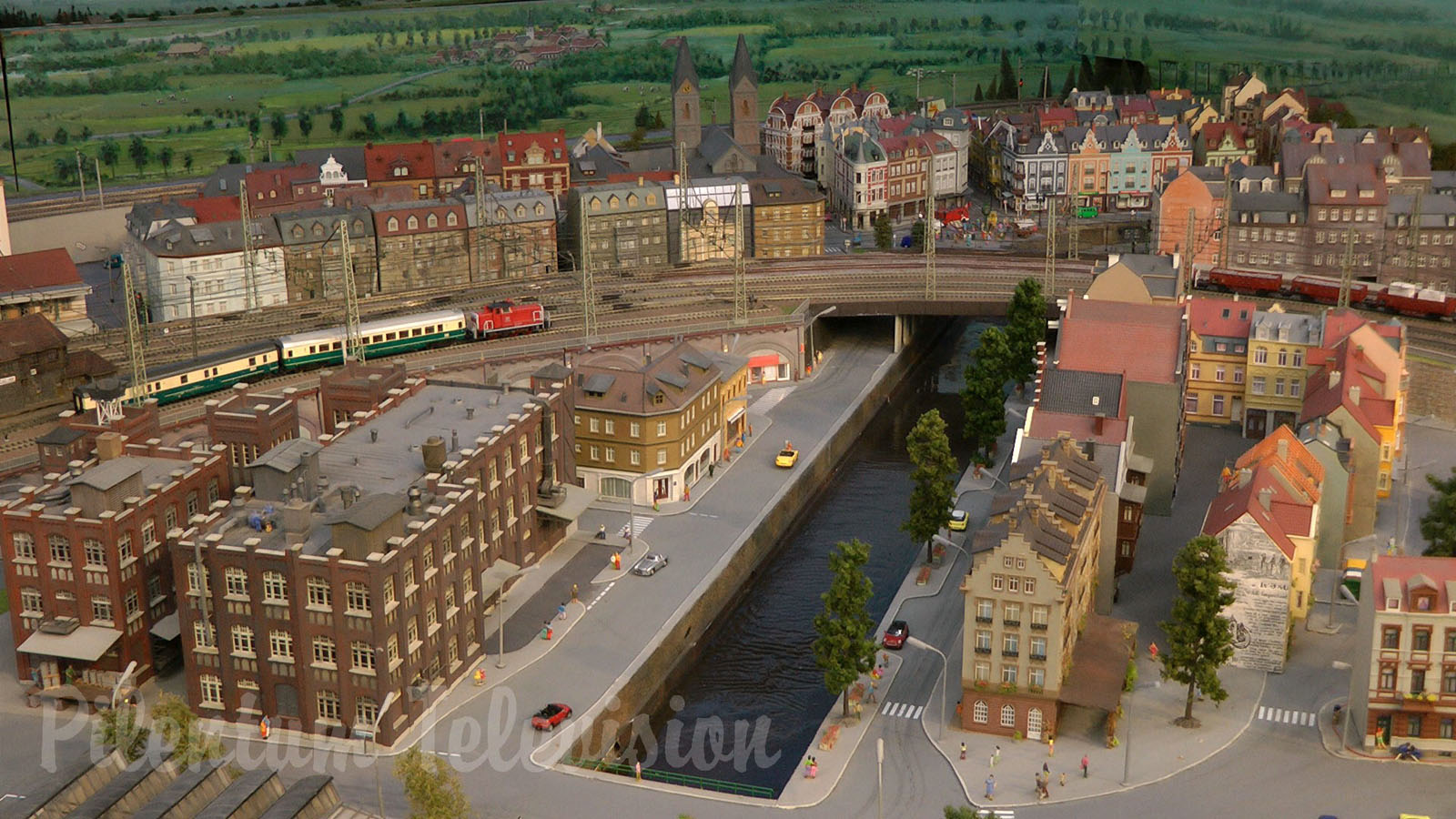 Model Railroad Layout by Modelspoor Group Nienoord with Miniature Cars and more than 100 Trains in HO Scale