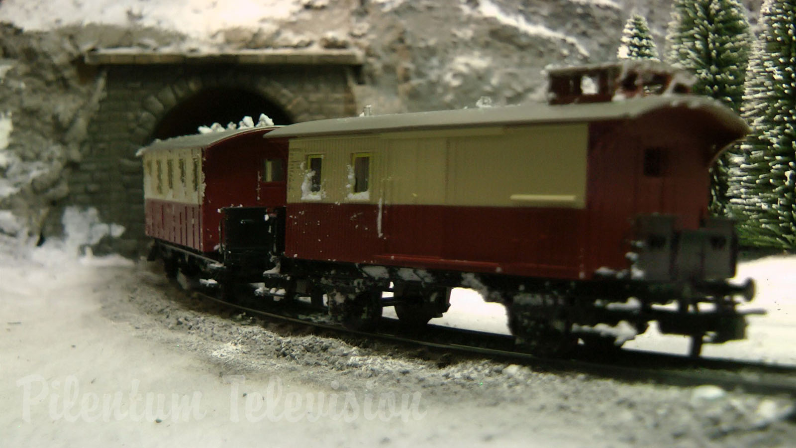 Cute and tiny model railroad layout with winter landscape by Hans Louvet