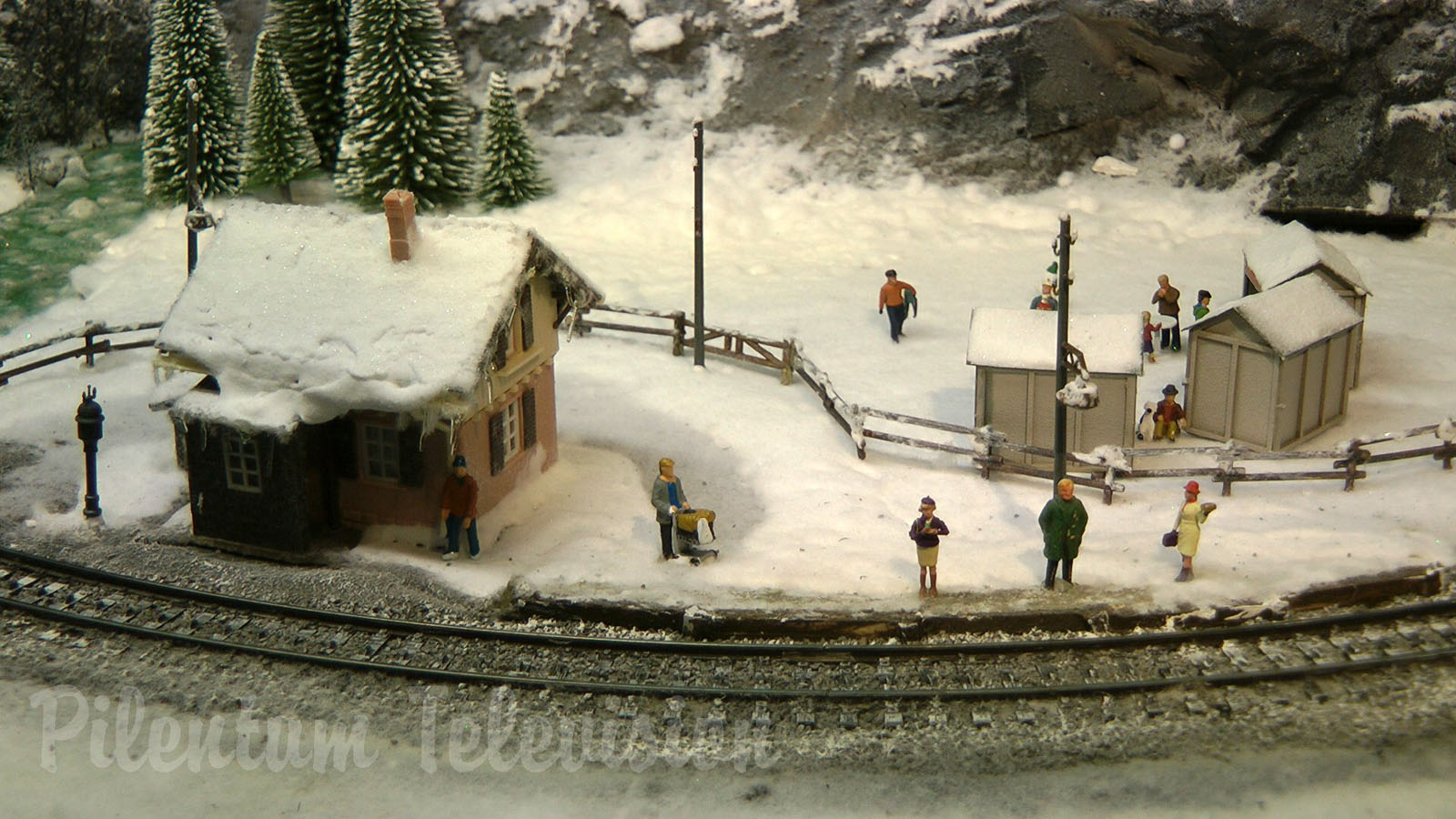 Cute and tiny model railroad layout with winter landscape by Hans Louvet