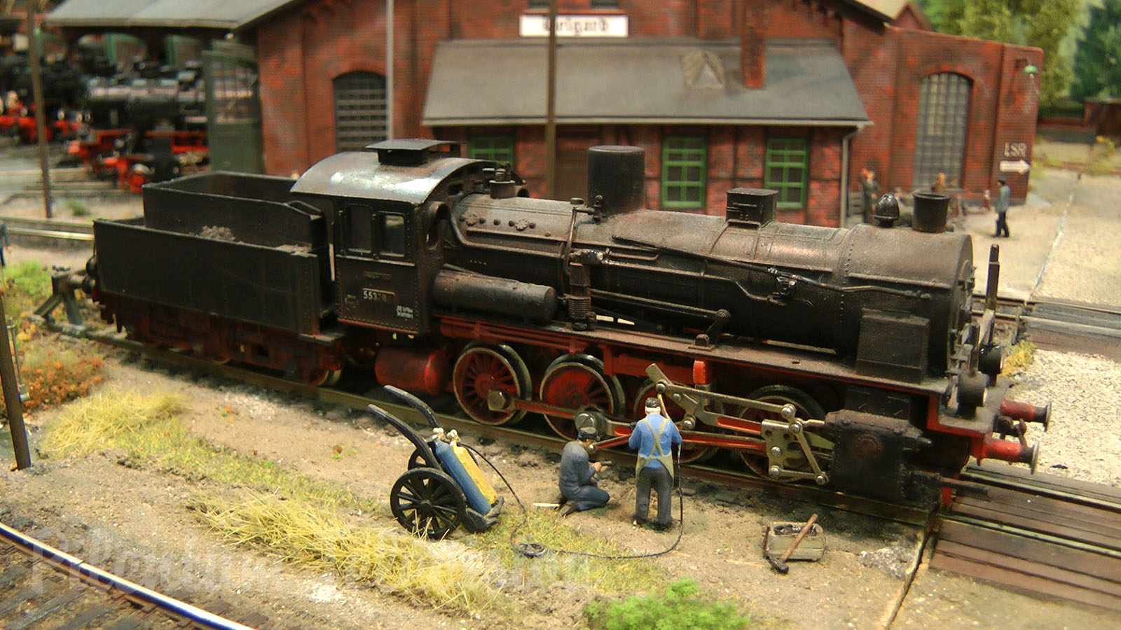 Model Railroad Layout with Steam Locomotive Depot in World War II