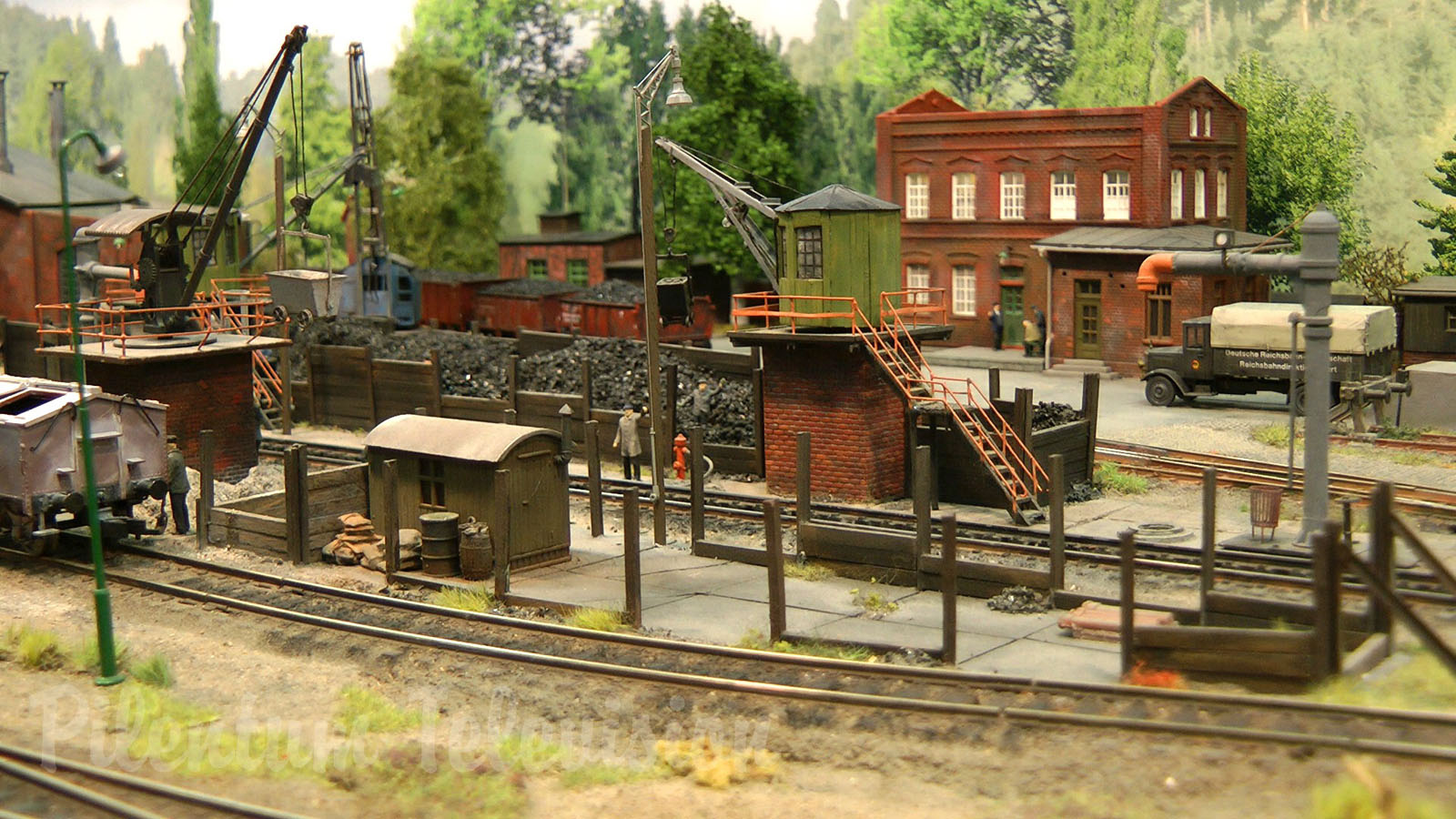 Model Railroad Layout with Steam Locomotive Depot in World War II