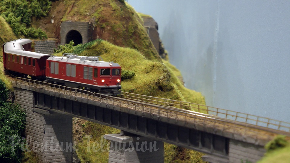 Model trains in action at the famous Gletsch railway station in Switzerland