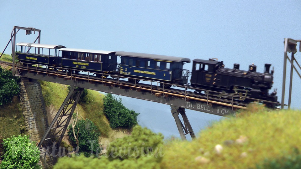 Model trains in action at the famous Gletsch railway station in Switzerland