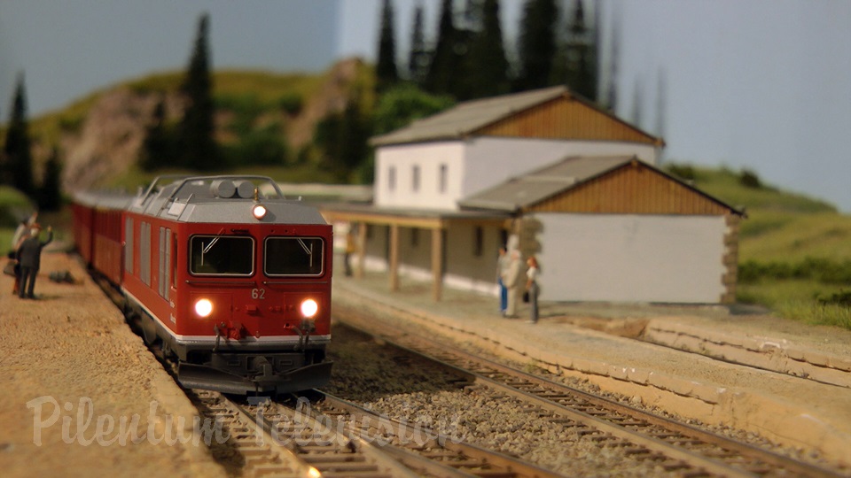 Model trains in action at the famous Gletsch railway station in Switzerland