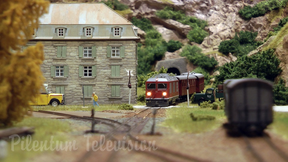 Model trains in action at the famous Gletsch railway station in Switzerland