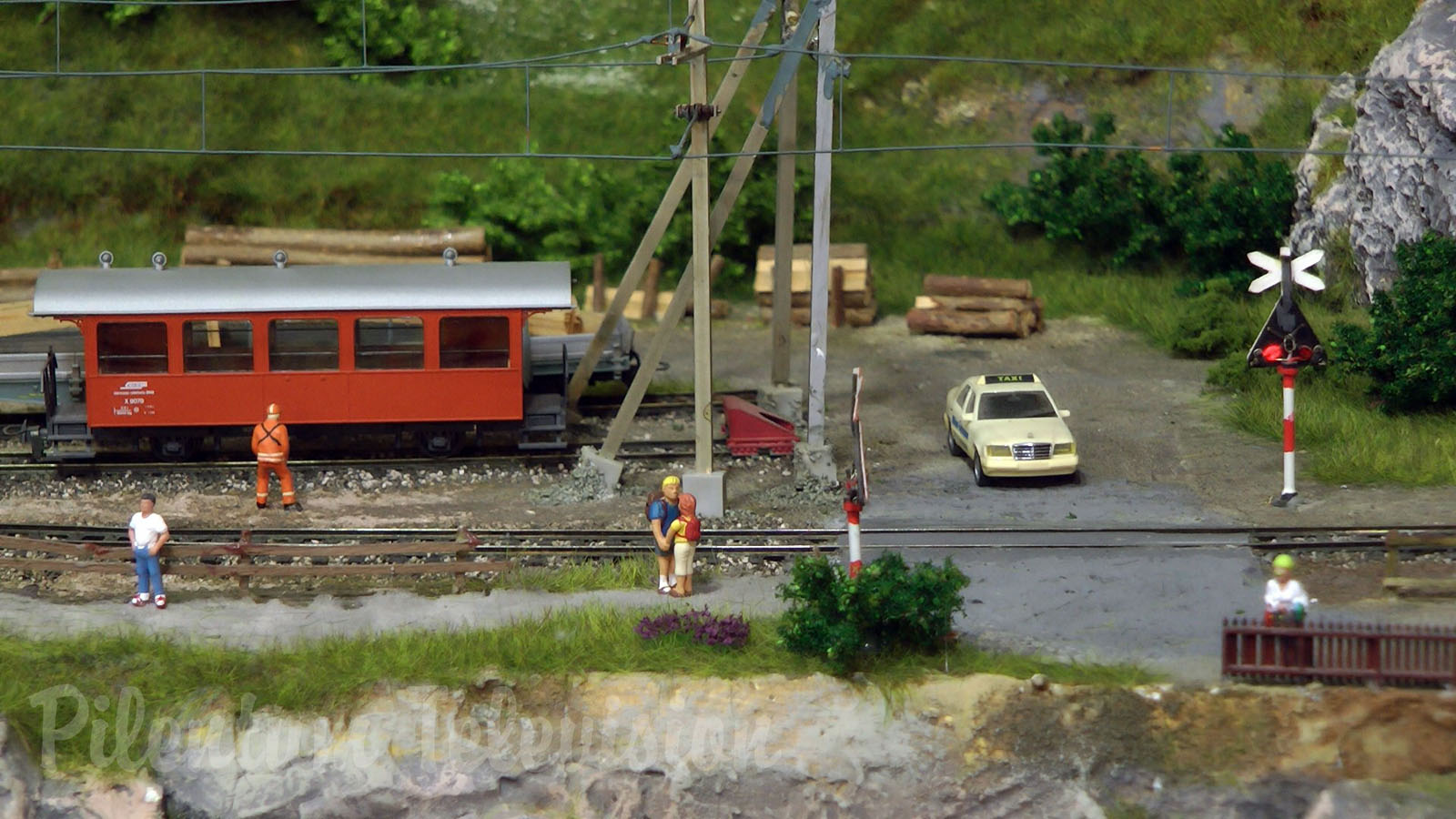 Model trains from Switzerland crossing the railroad bridge HOn3½